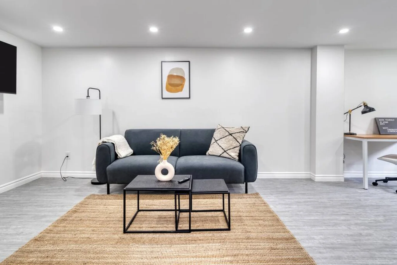 You feel at home as you settle into the living room, where the inviting atmosphere is perfect for lounging or entertaining.