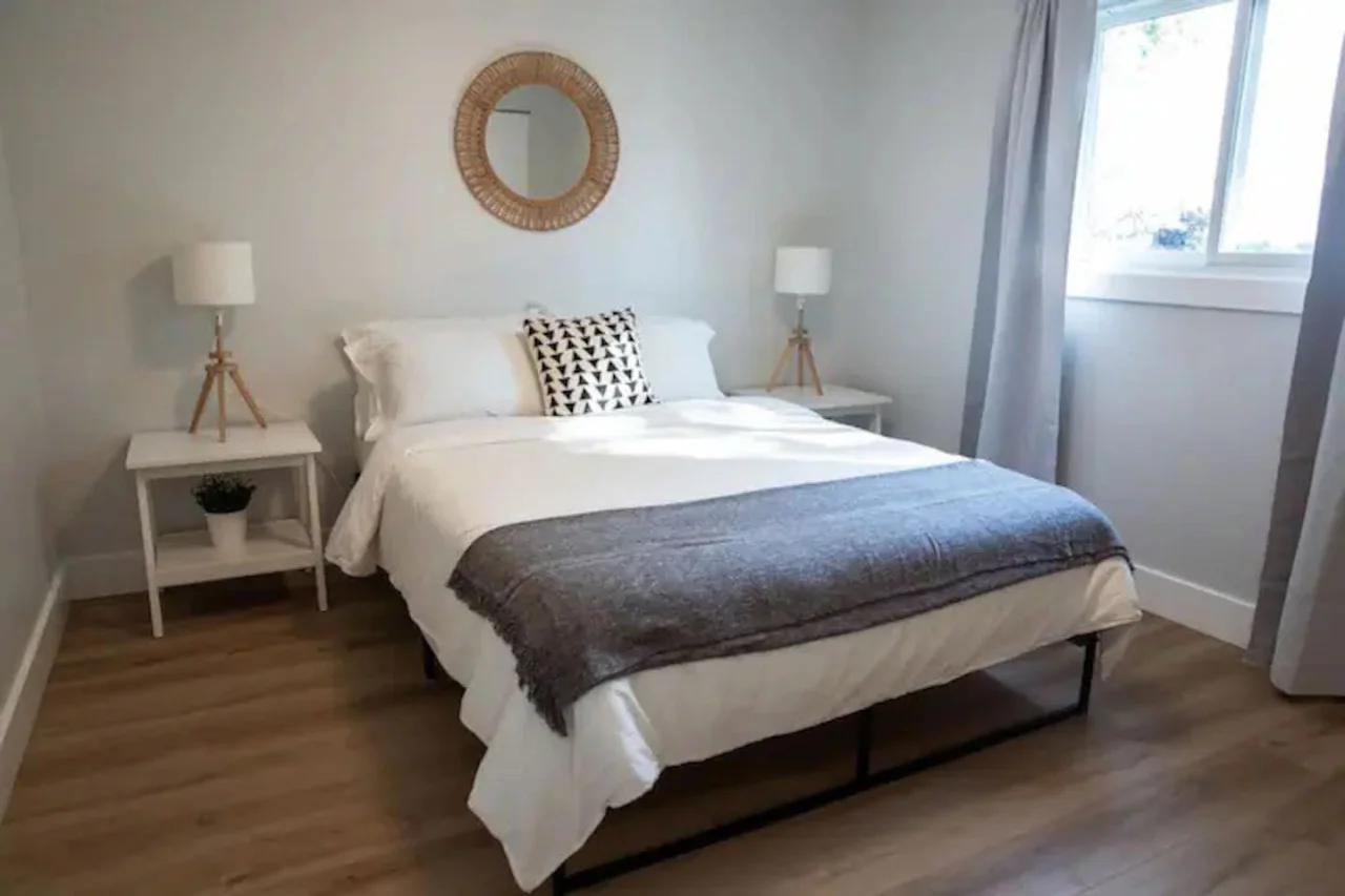 The bedroom offers a luxurious retreat, with a bed that promises restful nights and a room that feels like a private oasis.