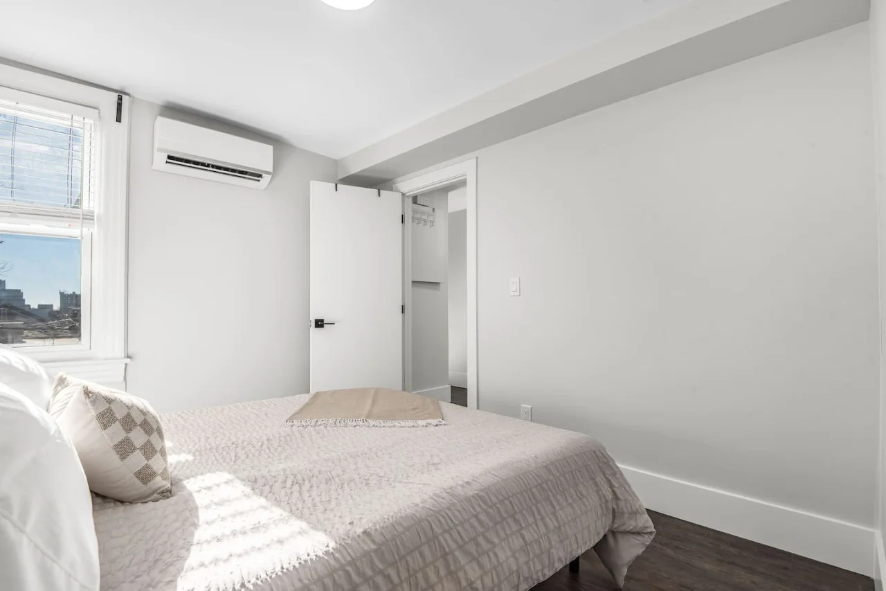 The bedroom’s serene ambiance invites you to relax, with a plush bed that promises a restful night's sleep.