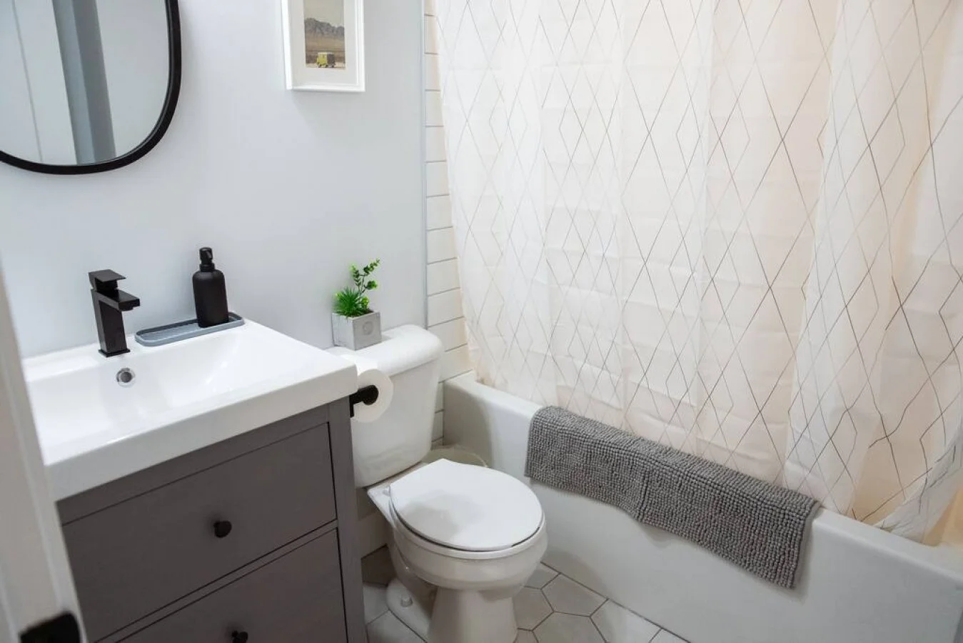 As you step into the bathroom, the clean lines and soothing colors create a space where you can relax and refresh.