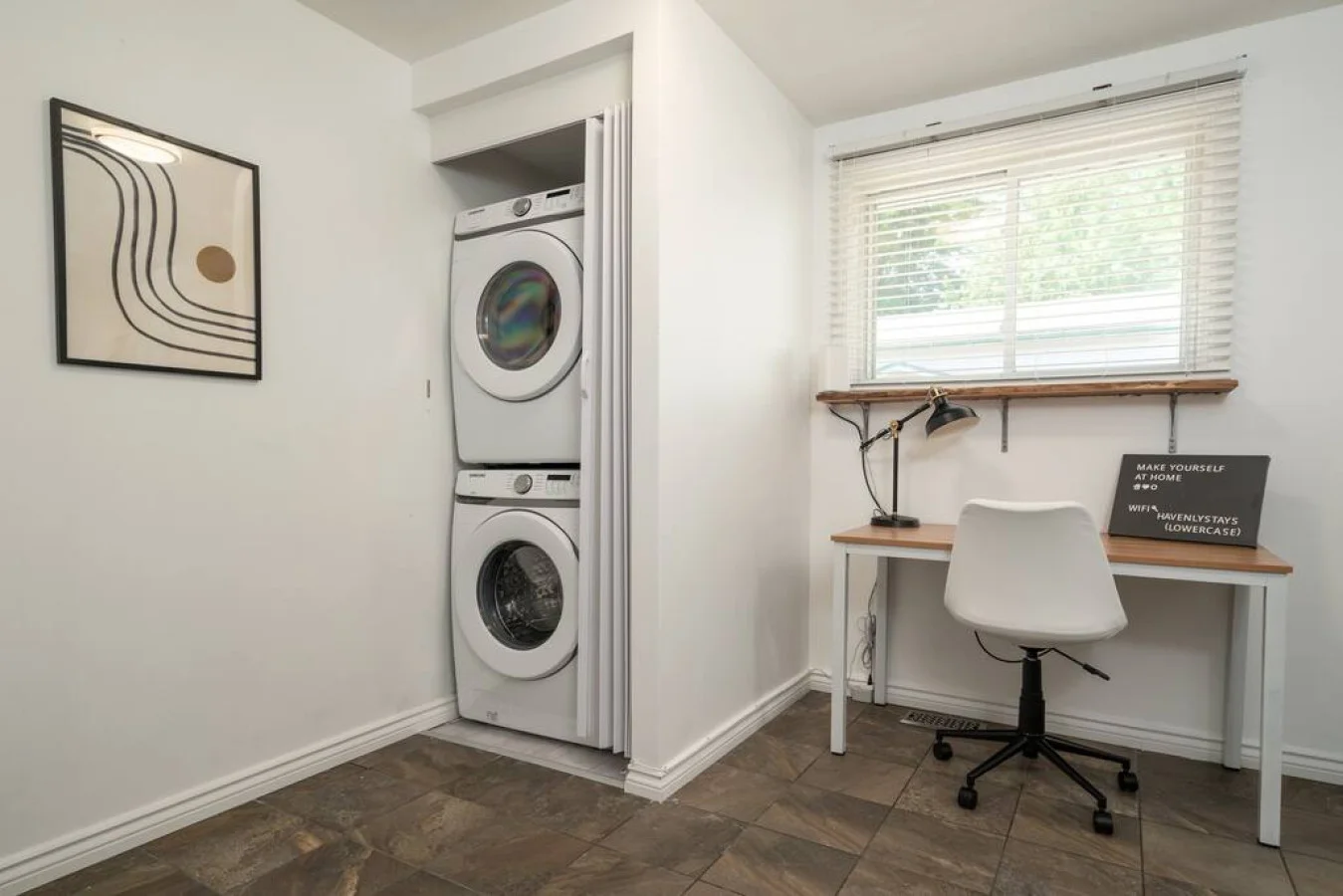Convenient laundry room with washer, dryer, and all necessary supplies, making it easy to take care of your laundry needs.