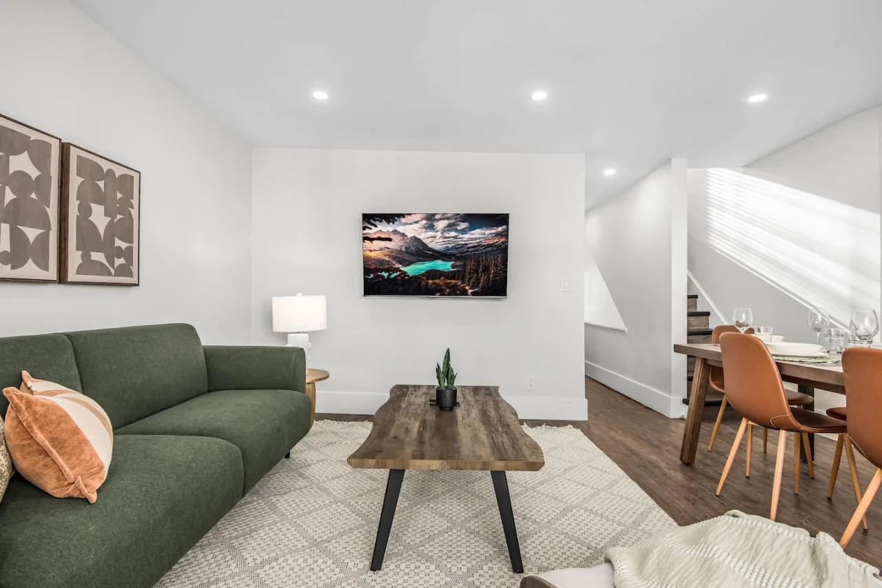 You are surrounded by tasteful decor and warm tones, making the living room a perfect setting for any occasion.