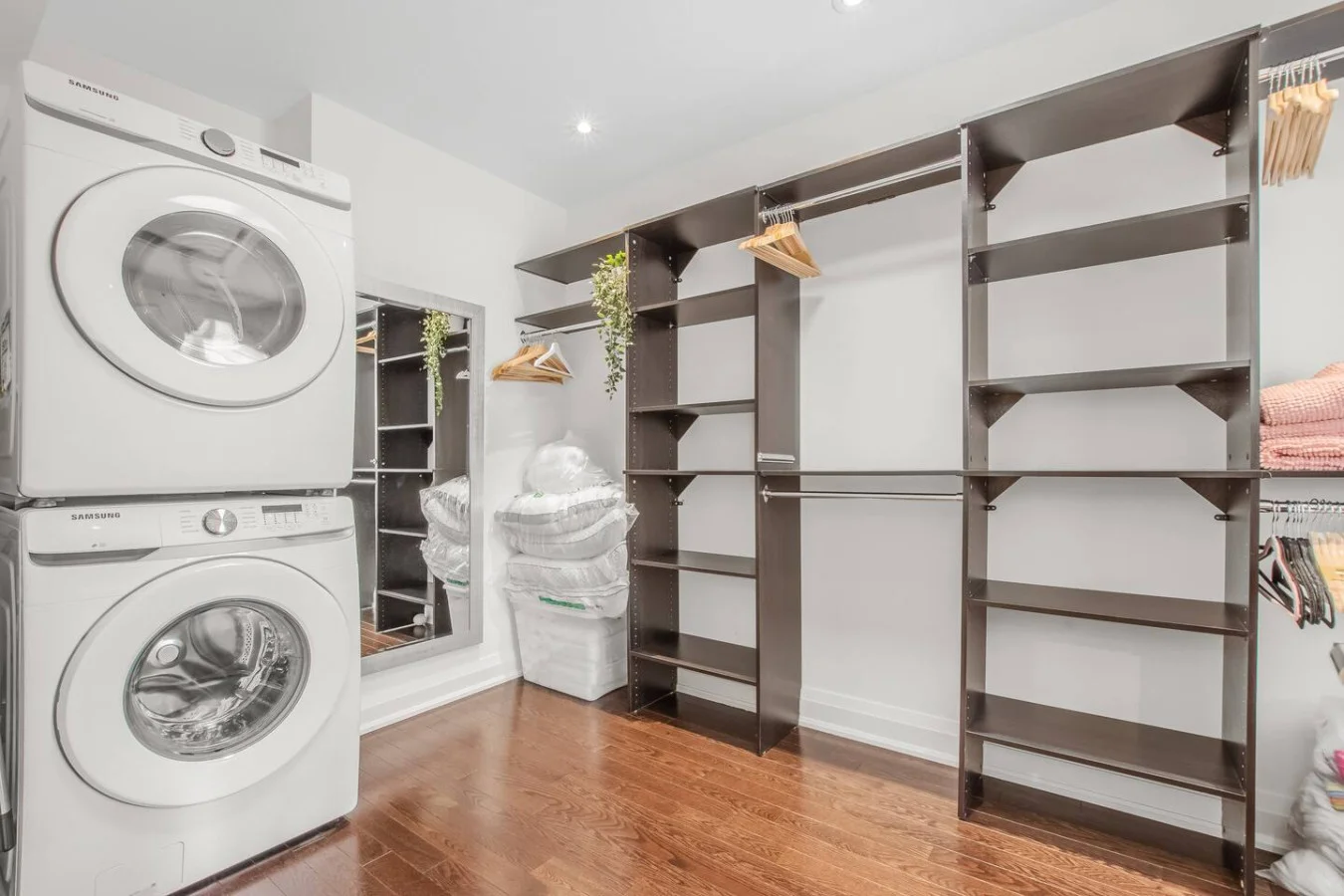 Walk-in closet with washer/dryer in master bedroom
