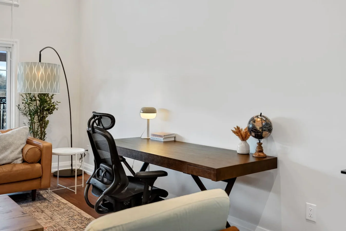 This cozy workspace area is perfect for productivity. Enjoy natural light, a comfortable chair, and a stylish desk setup. Ideal for work-from-home needs or planning your Dallas adventures.