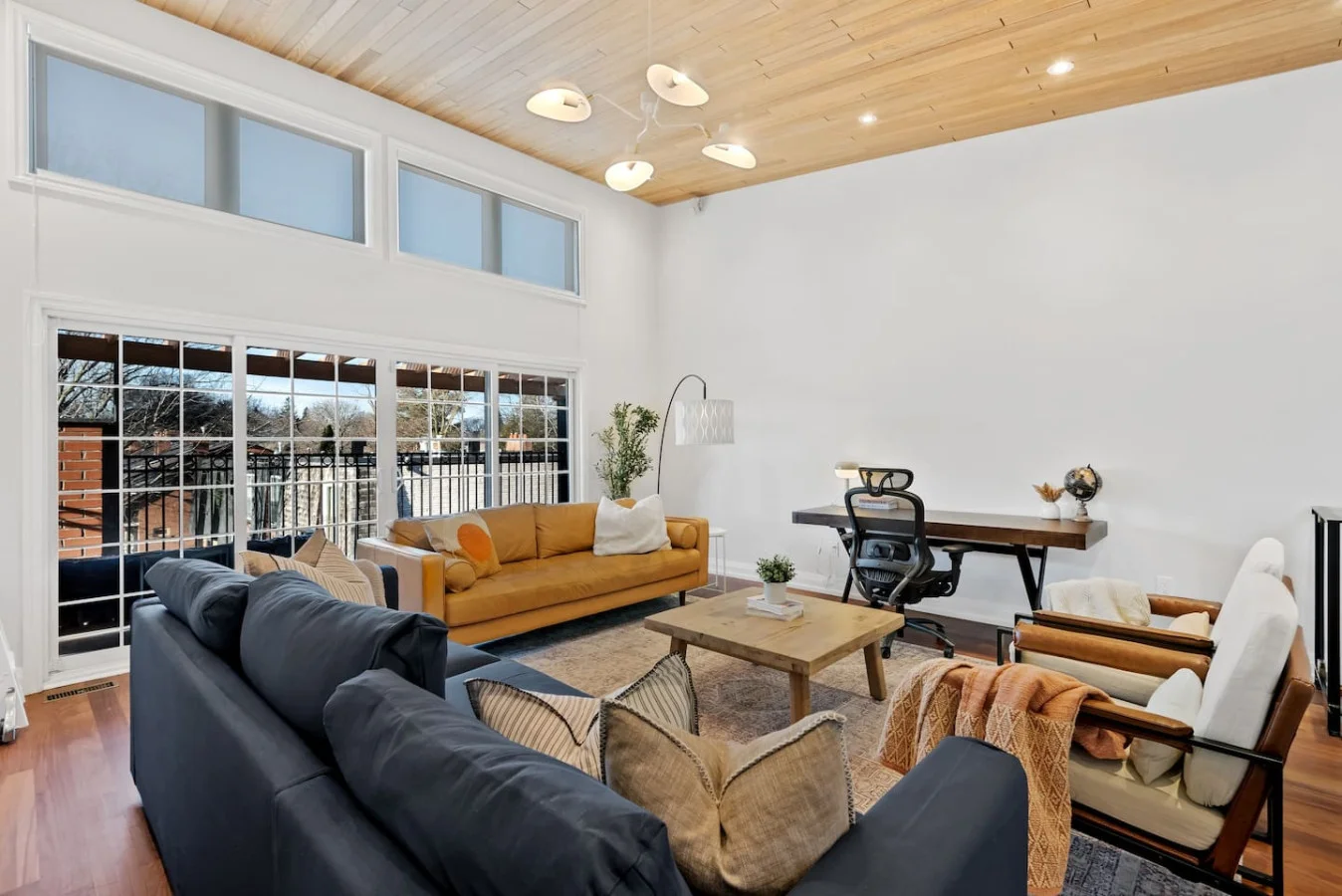 The living room is filled with natural light, creating a bright and welcoming space that invites relaxation.