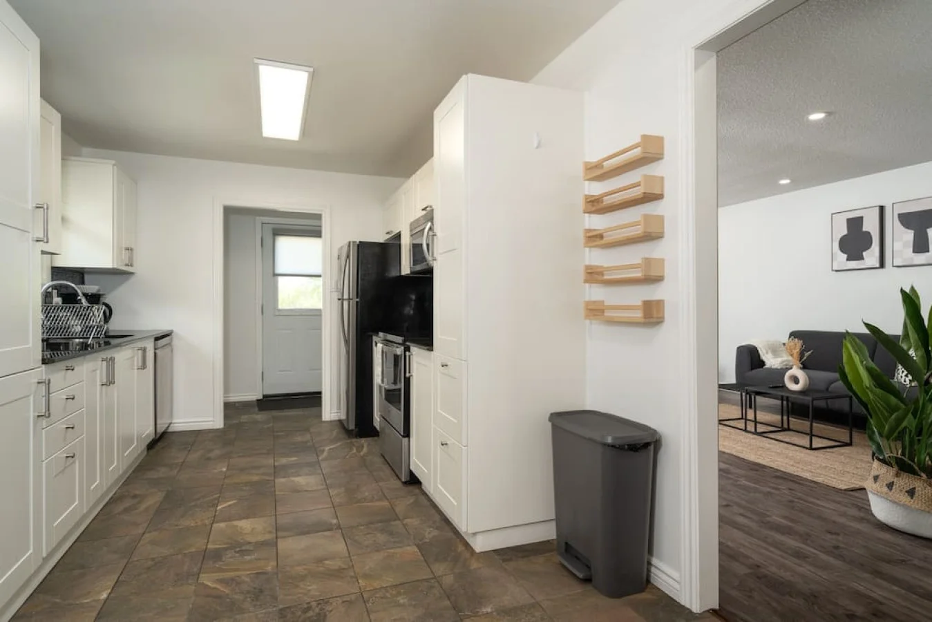 As you approach kitchen the elegant layout and well-stocked shelves make it the ideal spot to relax.