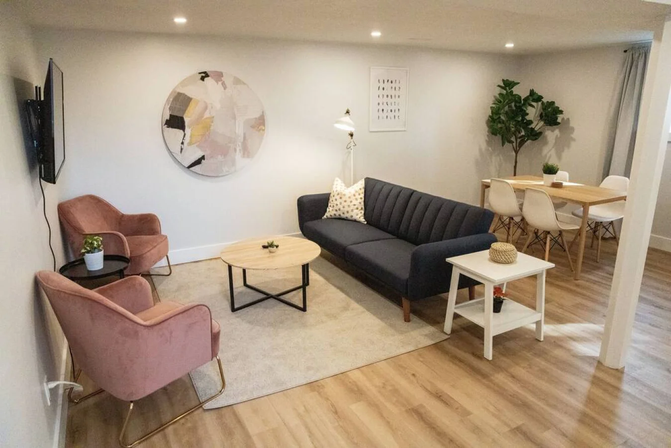 The living room’s cozy vibe makes it the perfect spot to relax, with ample seating and a warm ambiance.