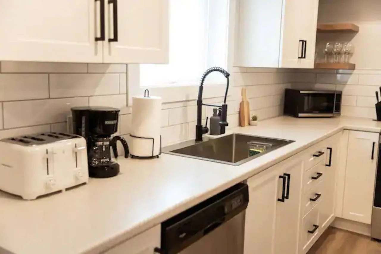 The kitchen invites you to experiment with new recipes, offering a stylish and practical space to cook and create.