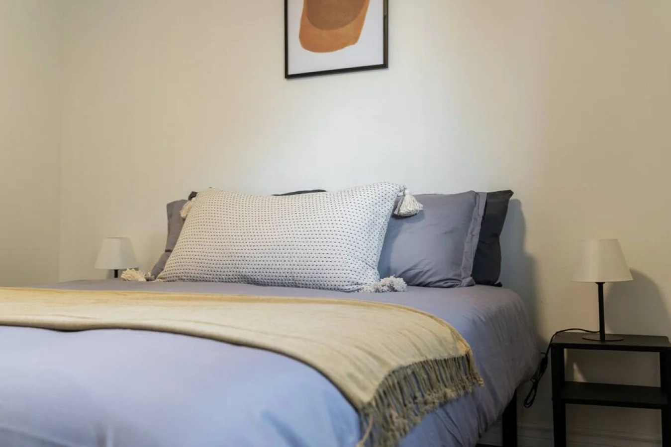 The bedroom offers a luxurious retreat, with a bed that promises restful nights and a room that feels like a private oasis.