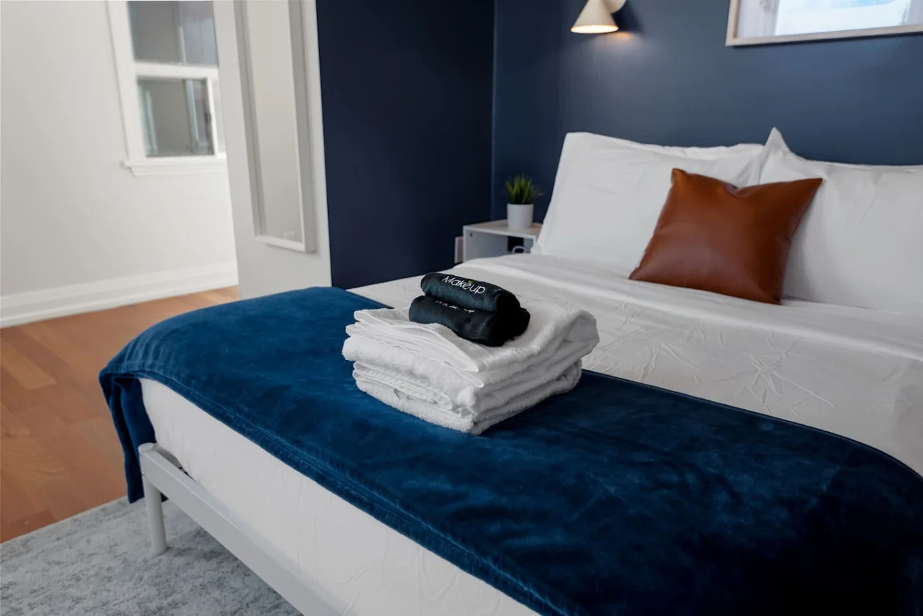 The bedroom offers a luxurious retreat, with a bed that promises restful nights and a room that feels like a private oasis.