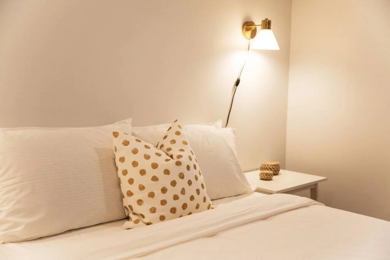 You feel enveloped in comfort as you relax on the queen bed, surrounded by a room designed for tranquility.