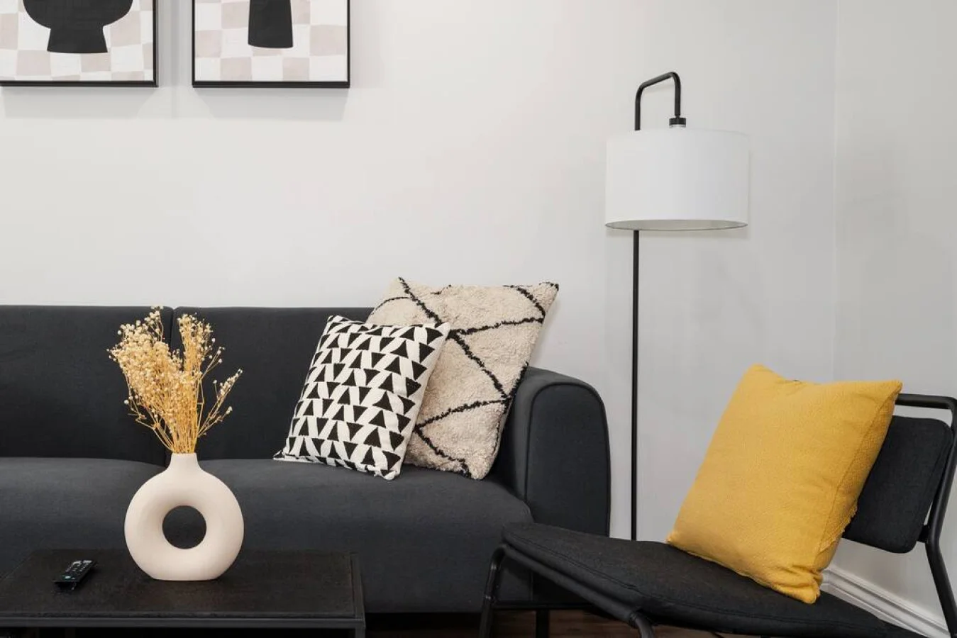 You feel a sense of peace as you step into the living room , with its inviting decor and soothing tones.