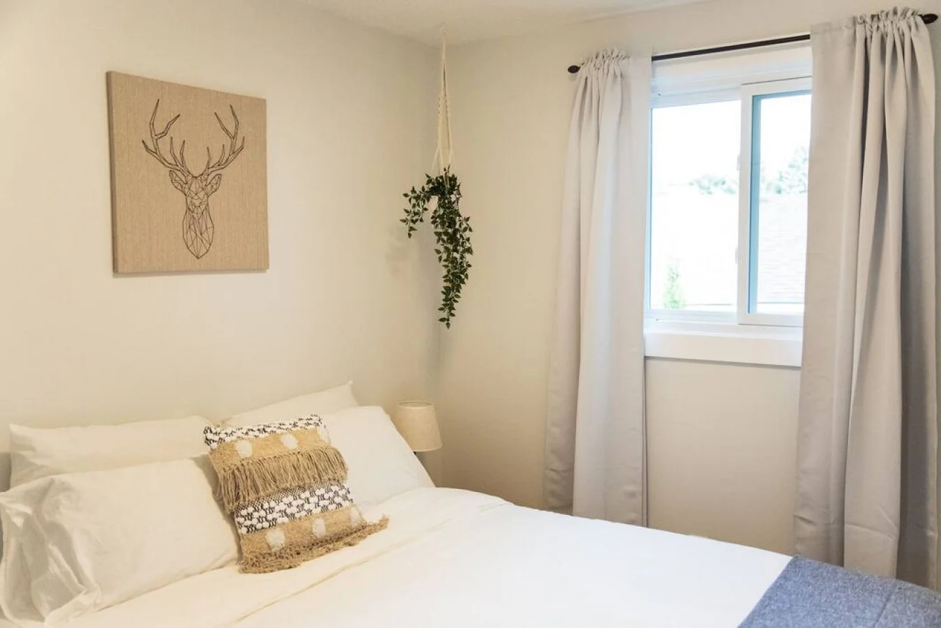 The bedroom’s serene ambiance invites you to relax, with a plush bed that promises a restful night's sleep.