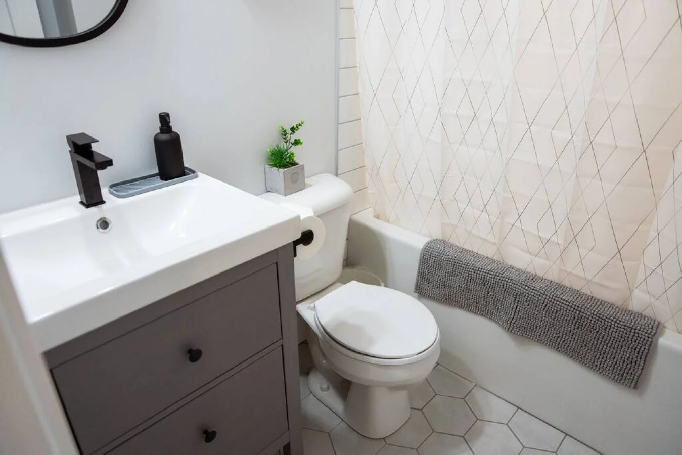 You feel a sense of calm as you enter the bathroom, where the thoughtful design and high-quality materials create a serene environment.