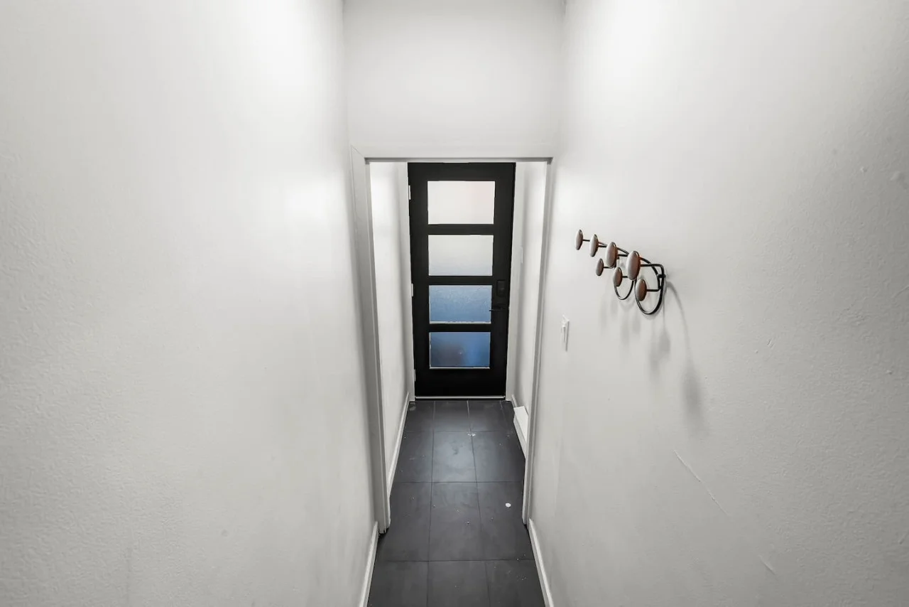 As you approach the house, the inviting entrance and beautiful exterior make you eager to explore what’s inside.