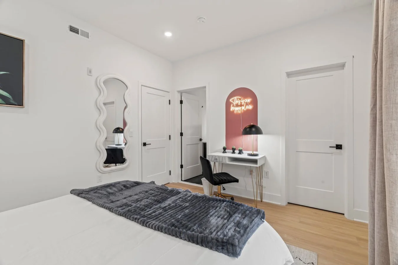 Spacious bedroom with stylish decor, perfect for unwinding after a day of exploring the local area.