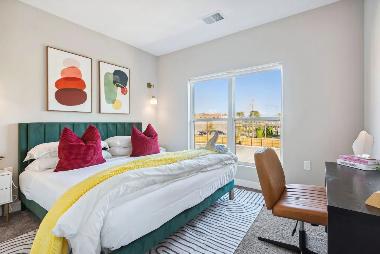 The queen bedroom’s stylish design and comfortable bedding create a perfect sanctuary for restful nights.