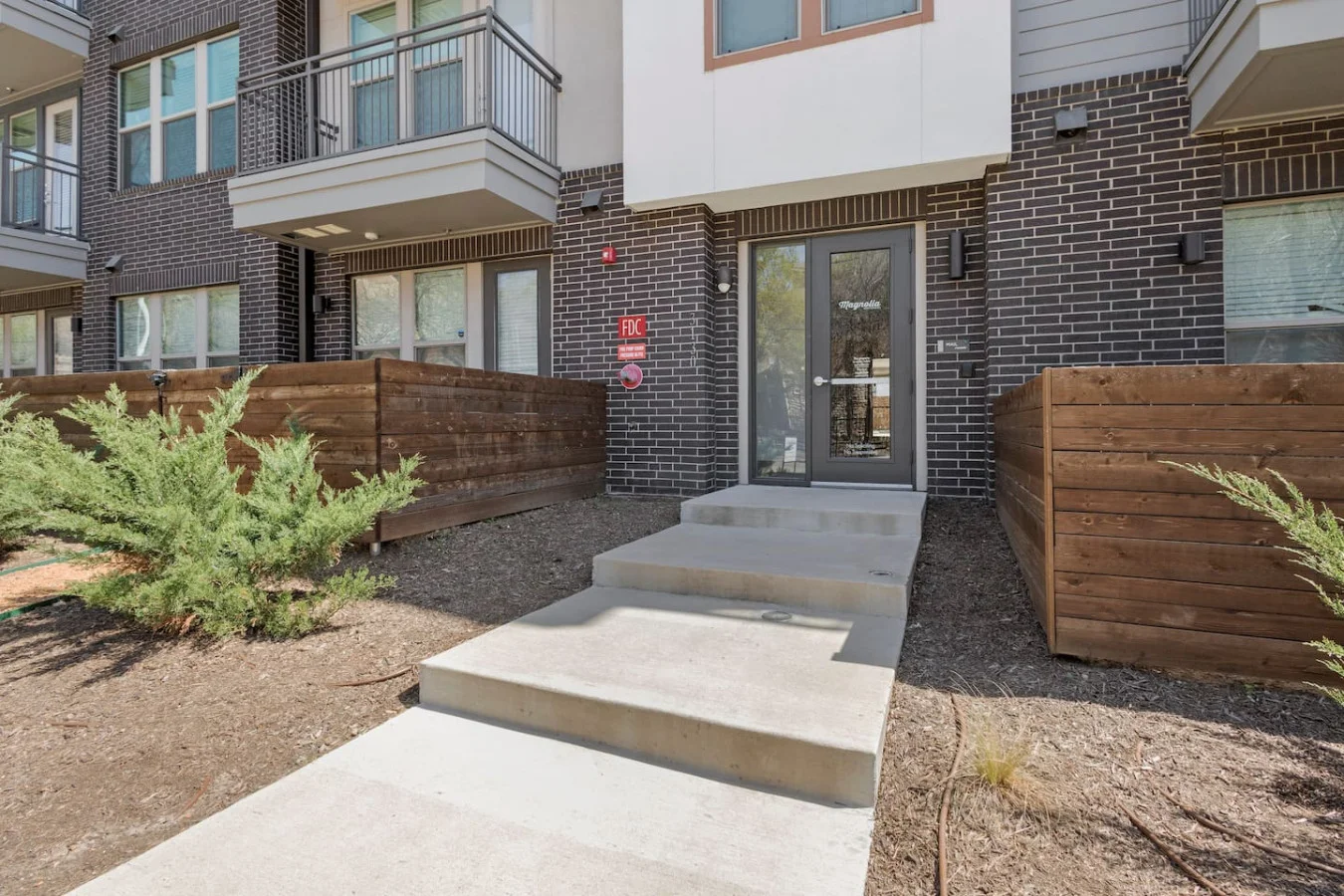 As you approach the house, the inviting entrance and beautiful exterior make you eager to explore what’s inside.
