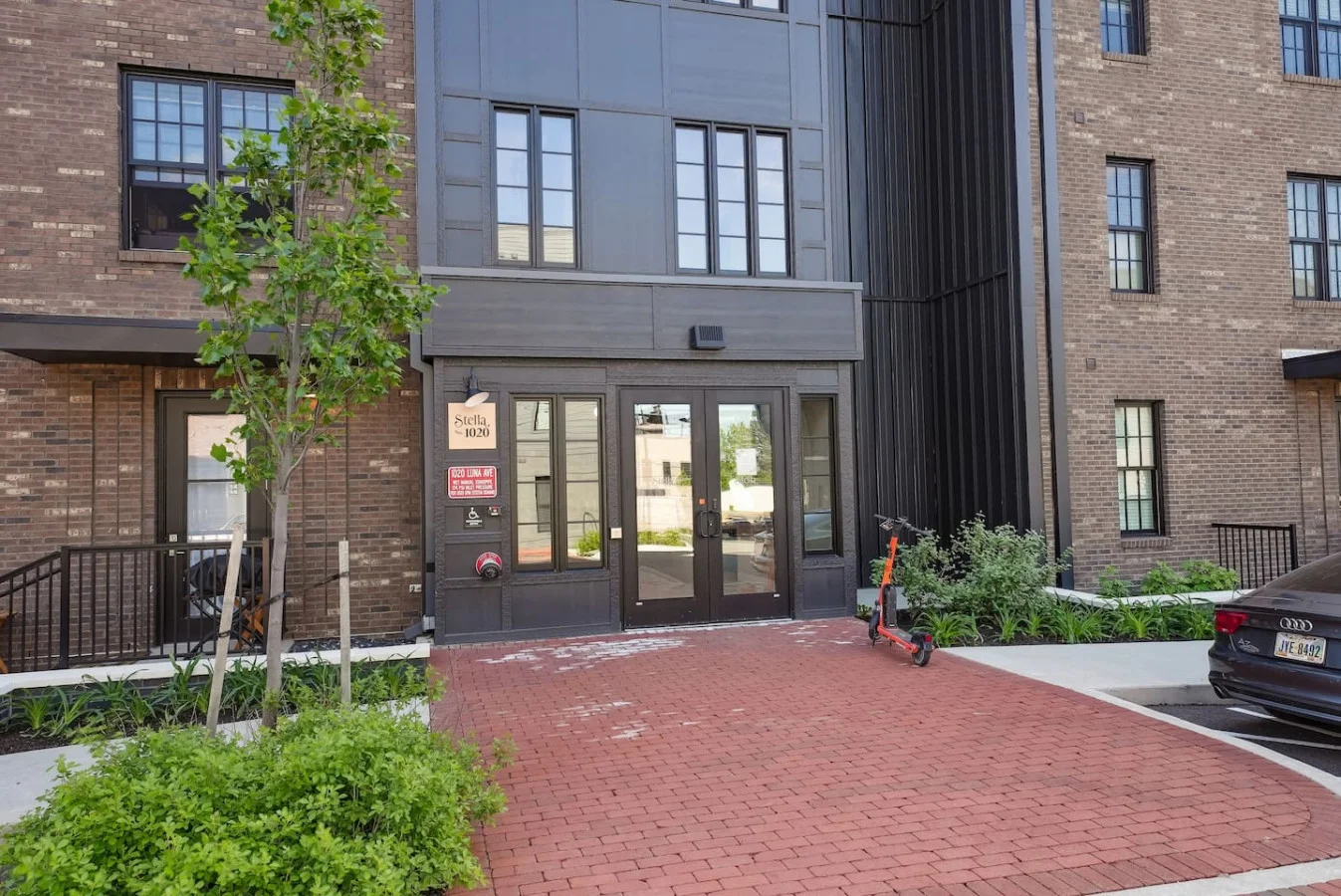 The outdoor area is a blend of modern and classic design elements, creating a welcoming and stylish facade.