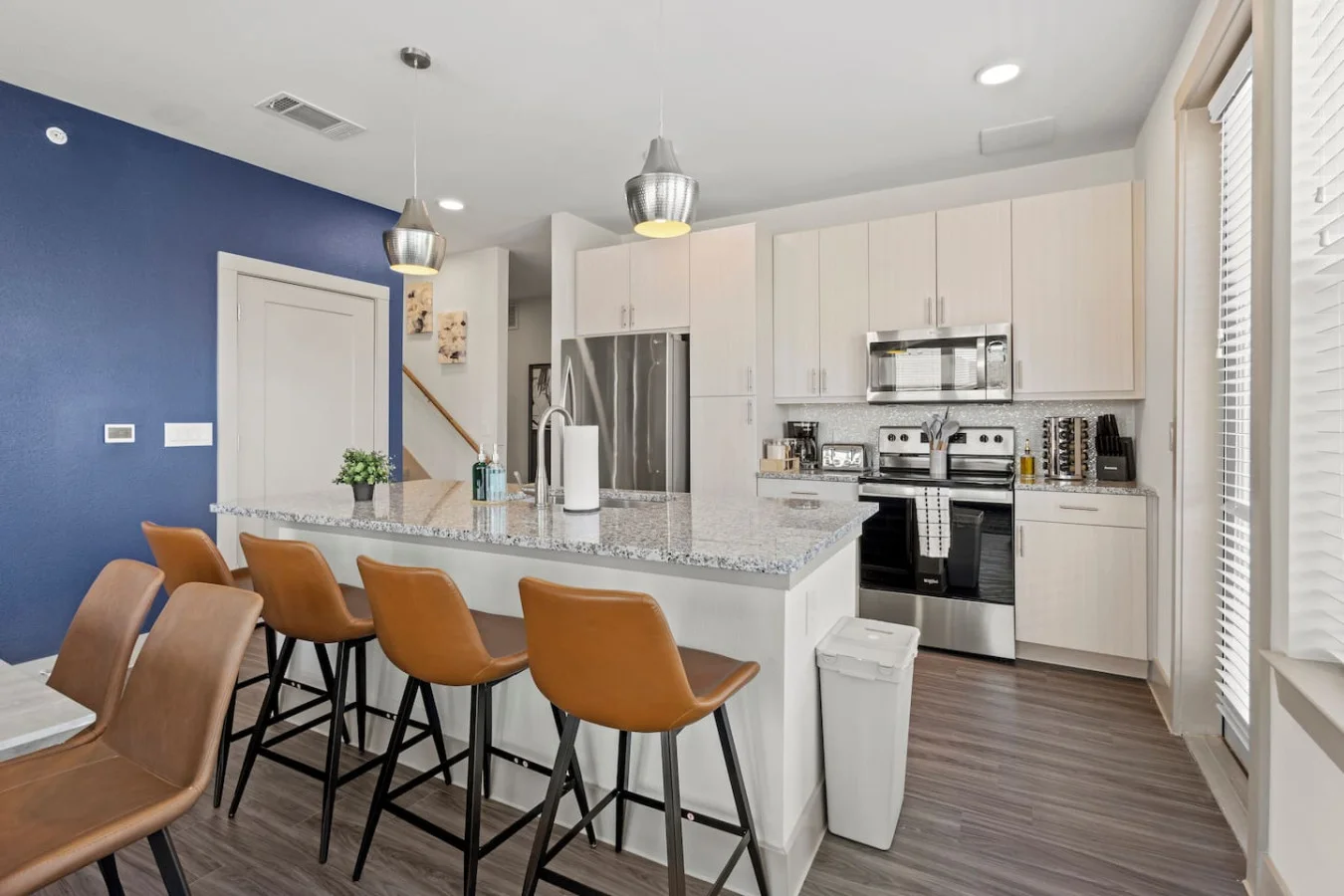 The spacious dining room invites you to savor every moment, whether enjoying a quiet meal or hosting a festive gathering.