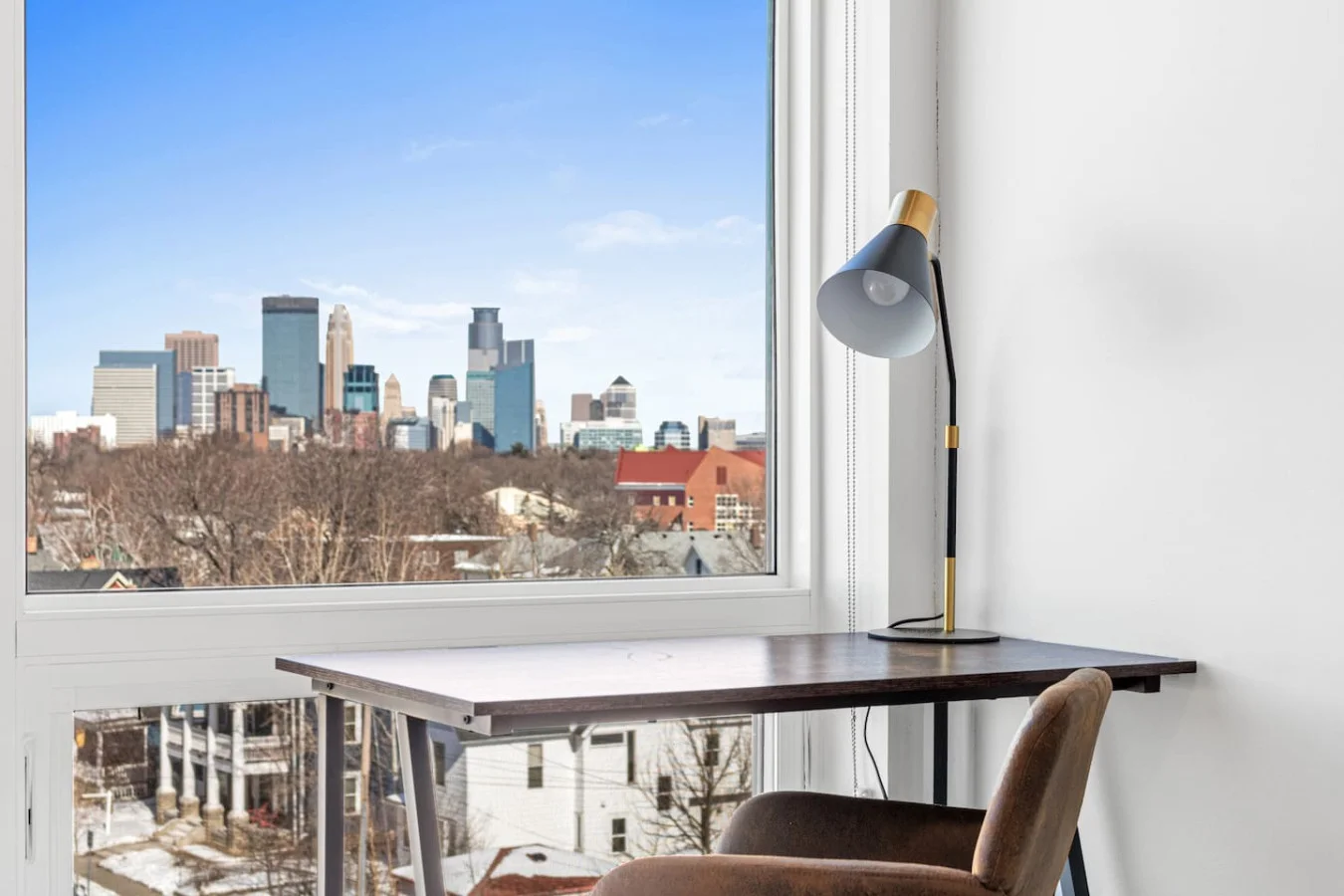 This cozy workspace with warm lighting, and a creative wall display, perfect for productivity.