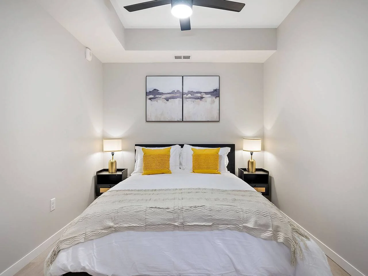 The bedroom offers a luxurious retreat, with a bed that promises restful nights and a room that feels like a private oasis.