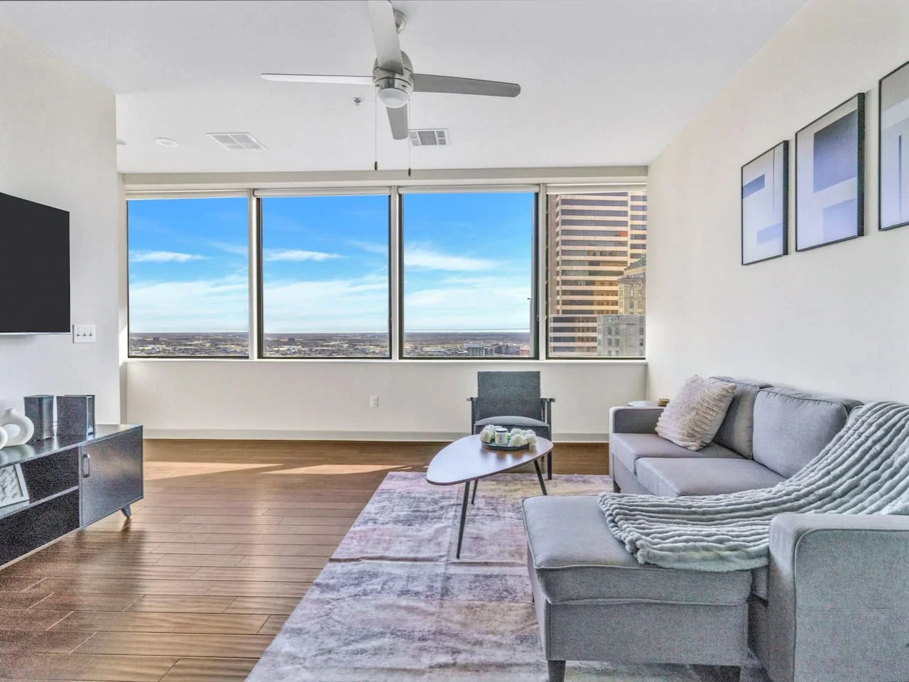 The living room is filled with natural light, creating a bright and welcoming space that invites relaxation.
