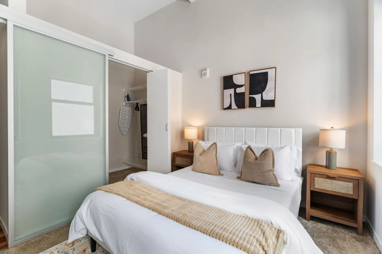 The bedroom offers a luxurious retreat, with a bed that promises restful nights and a room that feels like a private oasis.