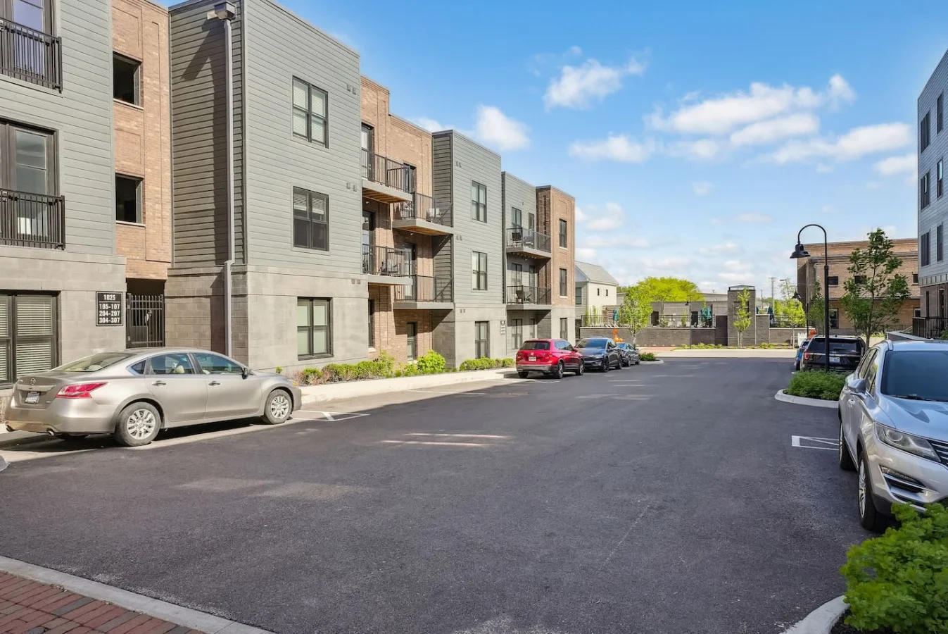 The outdoor area is a blend of modern and classic design elements, creating a welcoming and stylish facade.