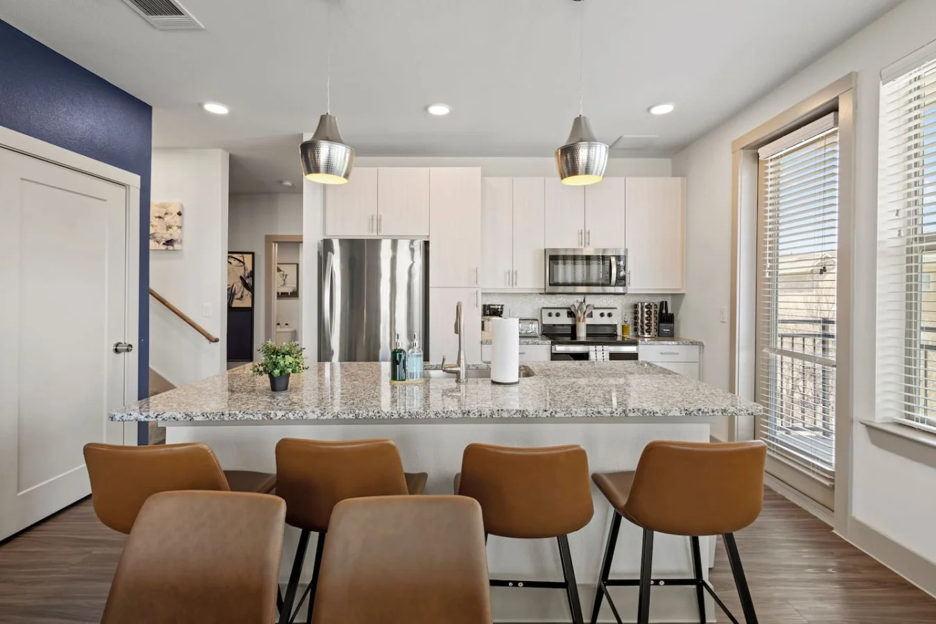 The spacious dining room invites you to savor every moment, whether enjoying a quiet meal or hosting a festive gathering.