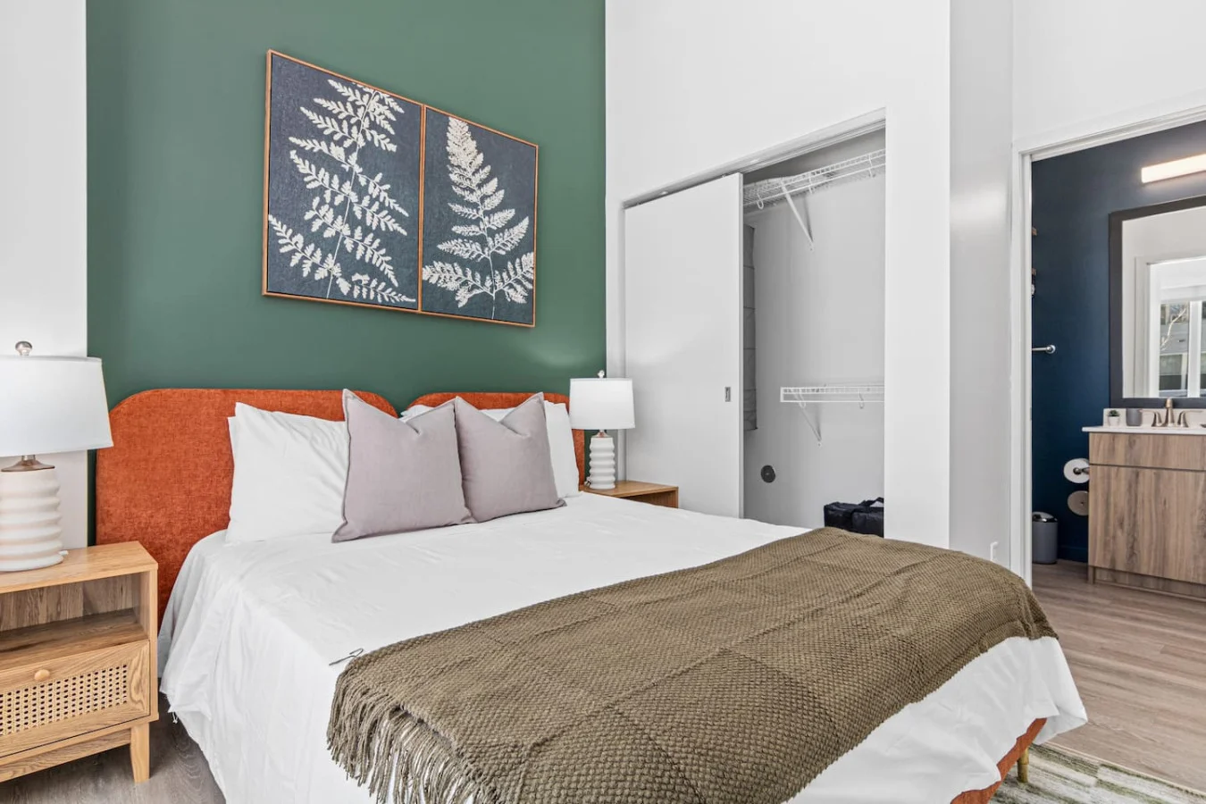 You feel enveloped in comfort as you relax on the queen bed, surrounded by a room designed for tranquility.