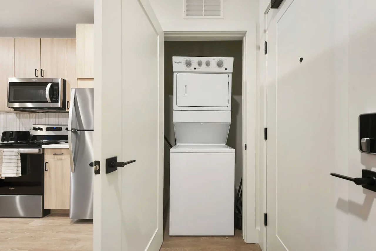 Convenient laundry room with washer, dryer, and all necessary supplies, making it easy to take care of your laundry needs.