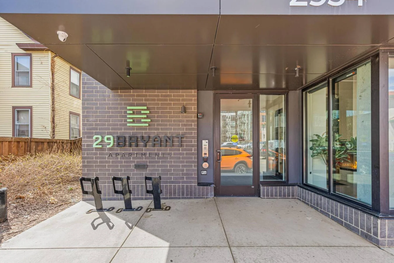 The outdoor area is a blend of modern and classic design elements, creating a welcoming and stylish facade.