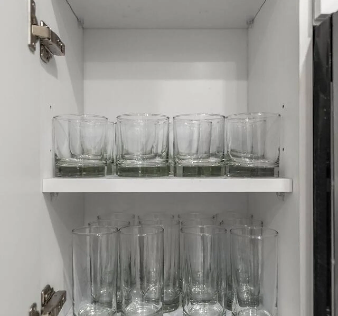 A set of glasses in the kitchen for your drinks.