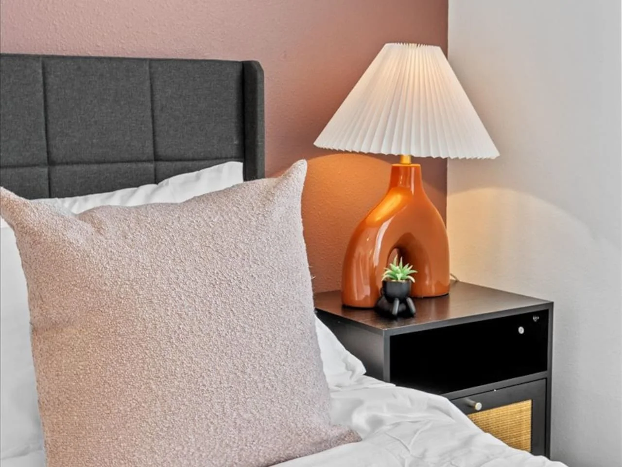 The queen bedroom’s stylish design and comfortable bedding create a perfect sanctuary for restful nights.