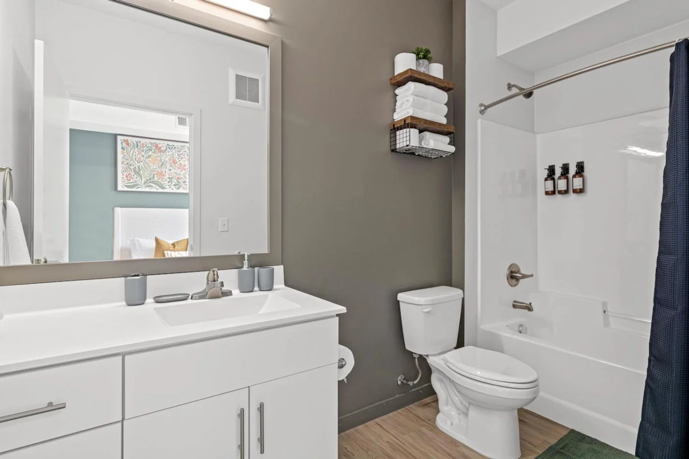 As you step into the bathroom, the clean lines and soothing colors create a space where you can relax and refresh.