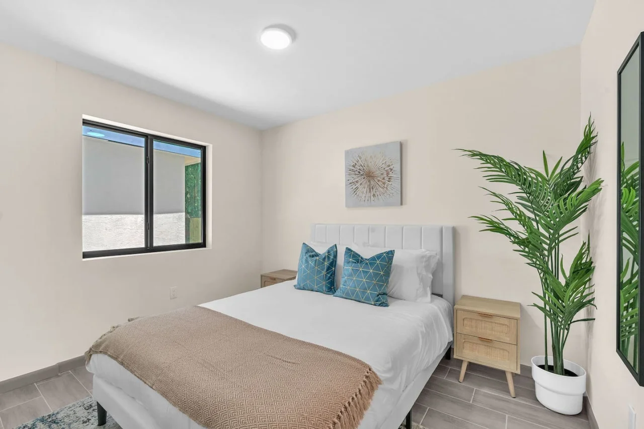 The bedroom’s serene ambiance invites you to relax, with a plush bed that promises a restful night's sleep.