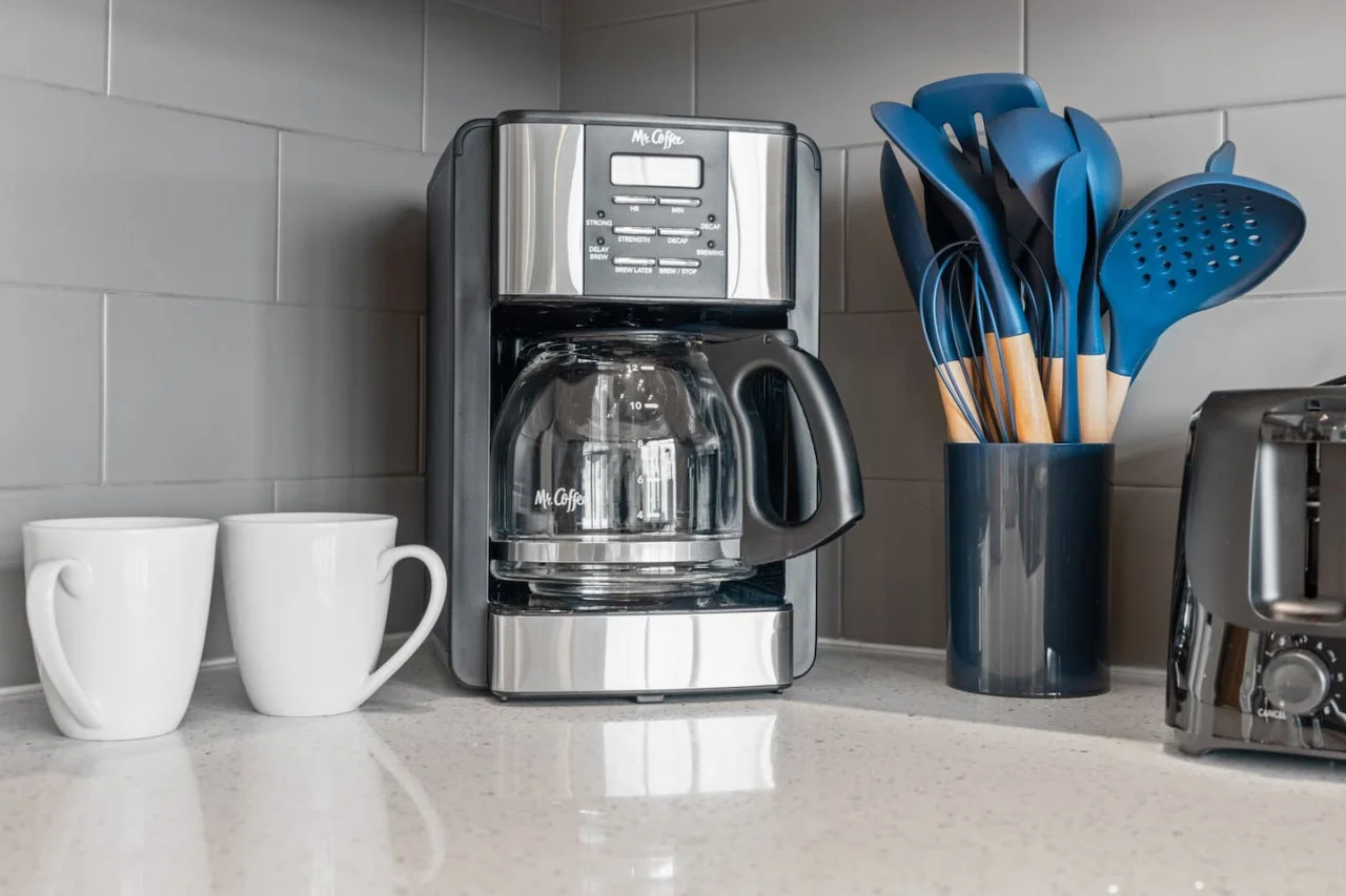 The coffee station is thoughtfully equipped with a variety of in-house consumables, including a selection of ground coffee, sweeteners, and creamers to suit every taste.