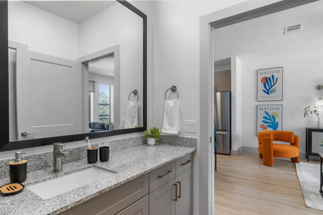 You feel a sense of calm as you enter the bathroom, where the thoughtful design and high-quality materials create a serene environment.