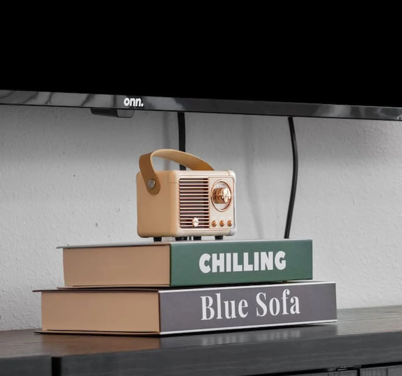 Enjoy a blend of modern comfort and style in this spacious living area. Featuring a plush sofa, chic decor, and a vibrant neon sign, it's perfect for relaxation and socializing.