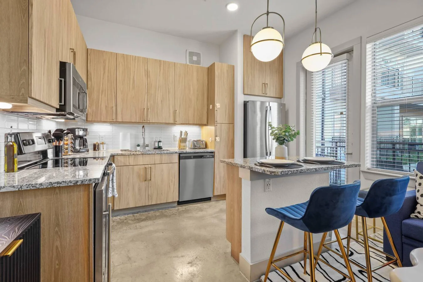 The kitchen’s open layout allows you to move freely as you prepare meals, with everything you need at your fingertips.