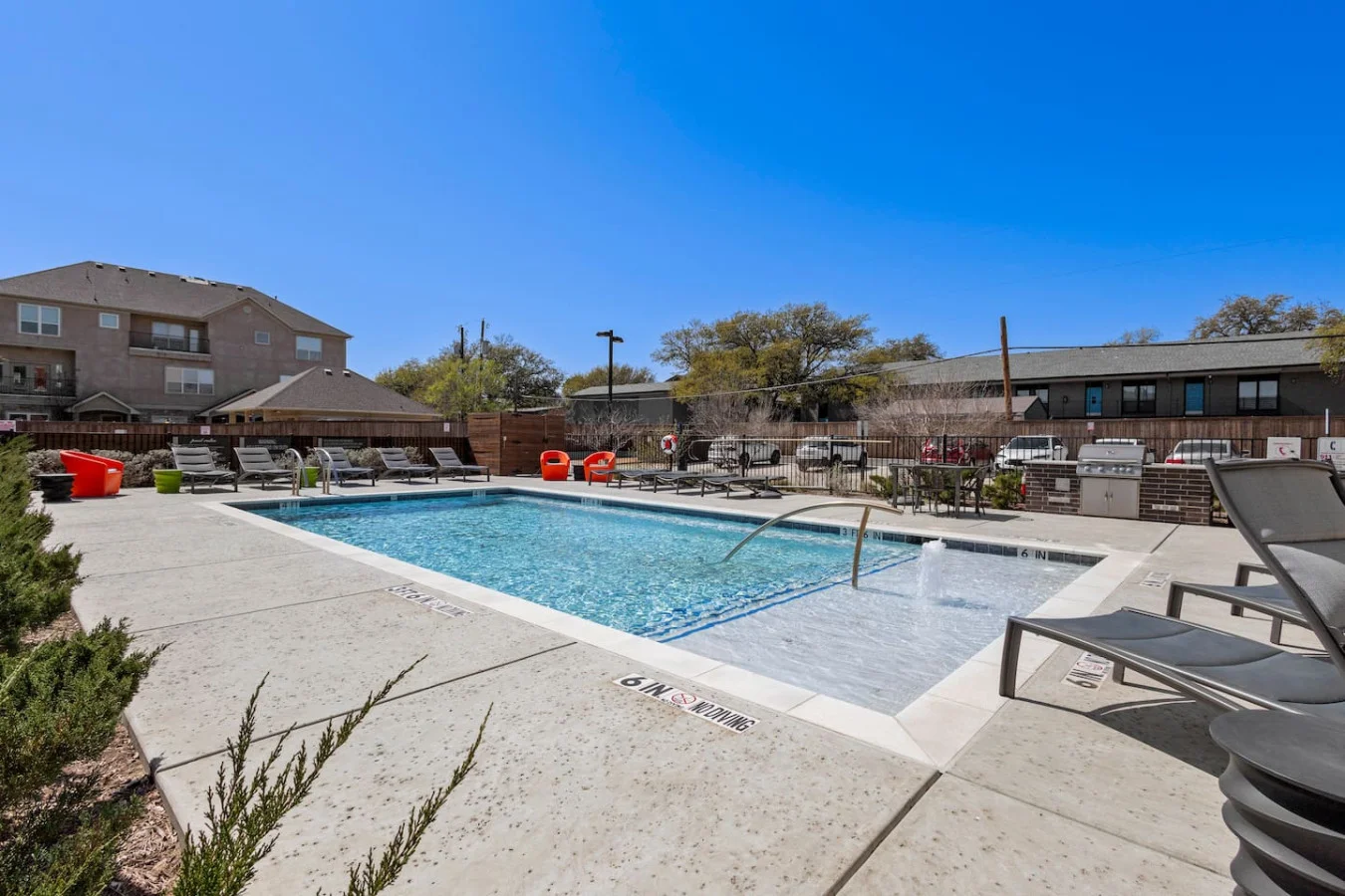 You can imagine yourself lounging by the pool, surrounded by greenery and the gentle sound of water.