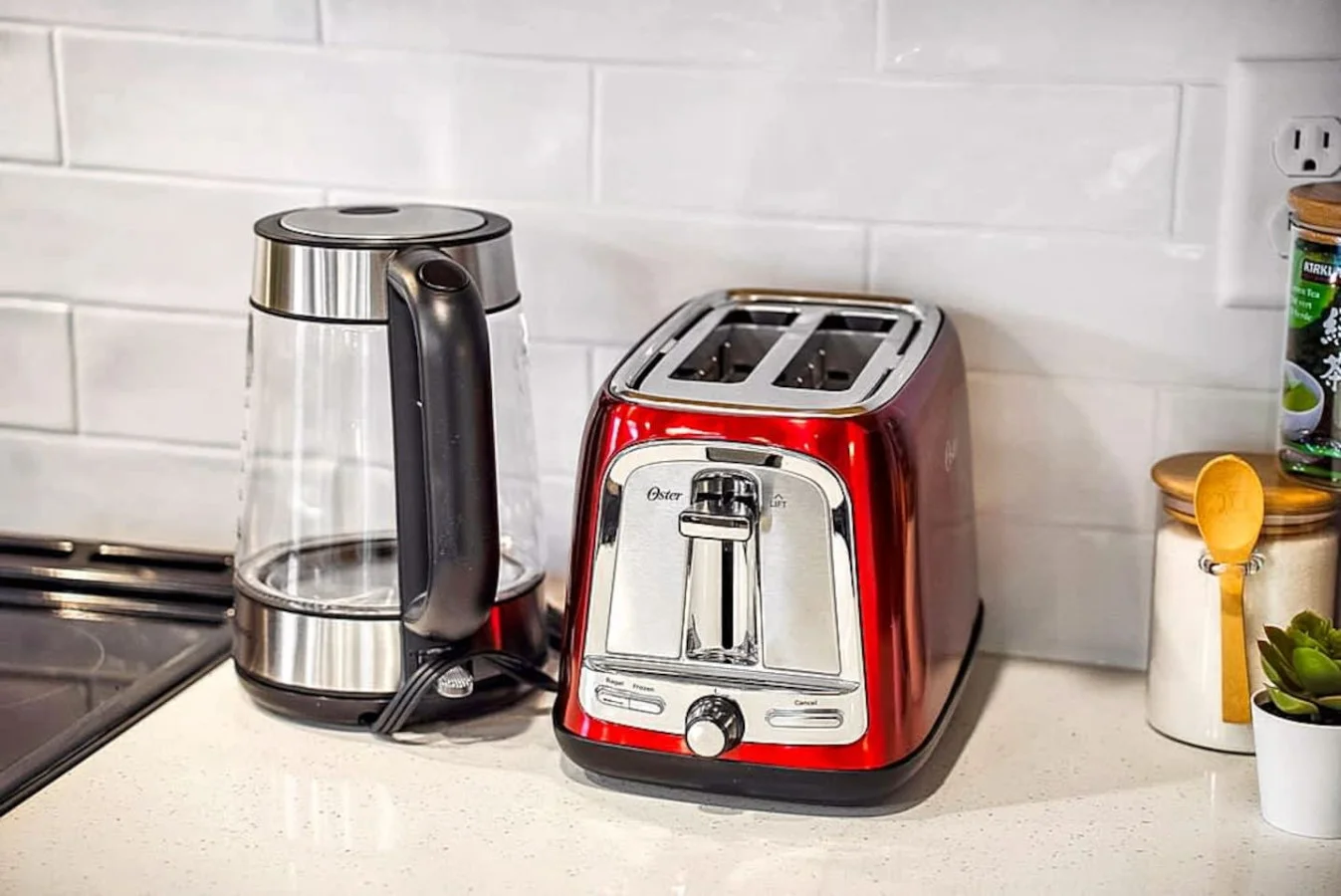 A well equipped countertop featuring a kettle, toaster, and food prep items. Perfect for quick breakfasts or snacks, giving guests the convenience of home during their stay.