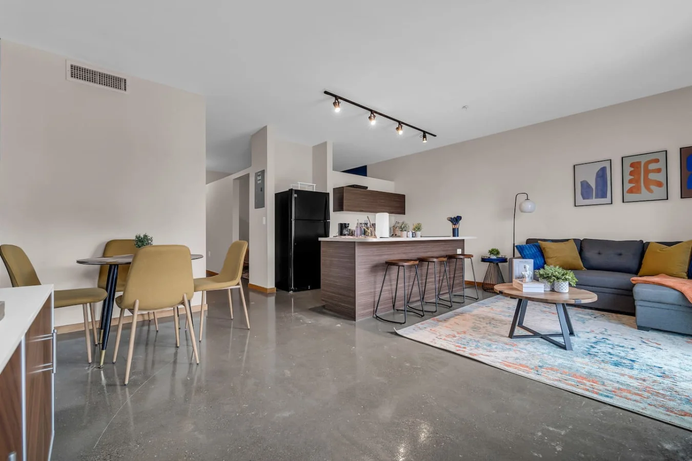 An open-concept area featuring a modern furnishings, and a stylish entertainment setup—ideal for gatherings and relaxation.