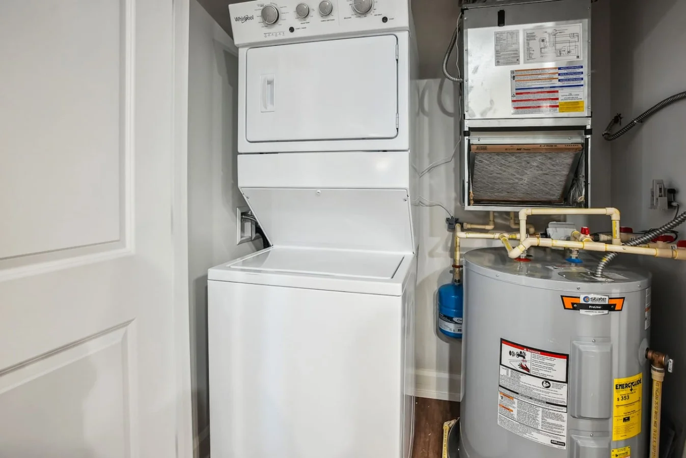 As you step into the laundry room, the modern appliances and ample storage space make it easy to keep things tidy.