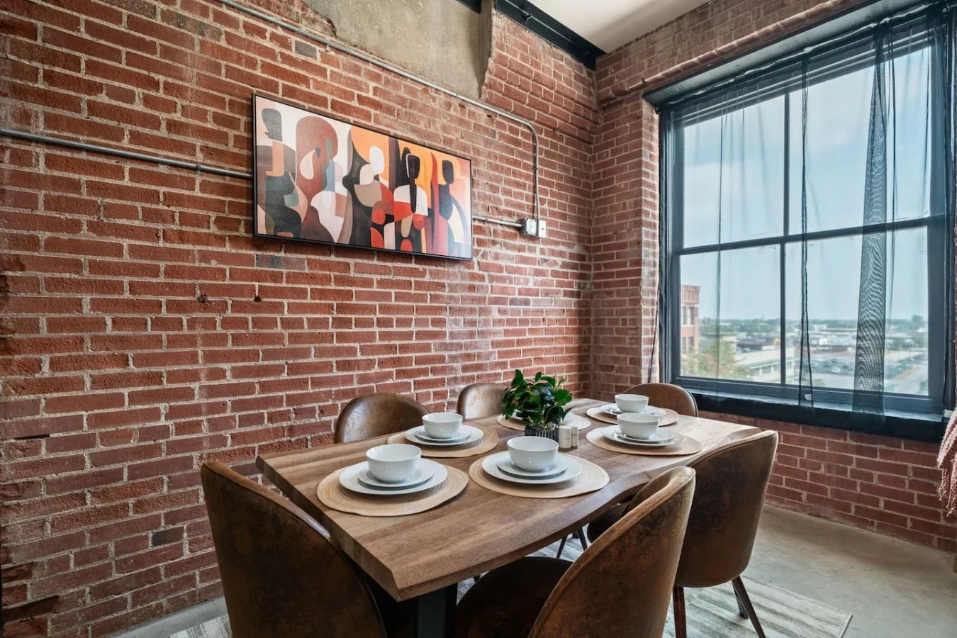 Dining table seats six guests comfortably (up to eight in total). Full tableware including wine glasses available.