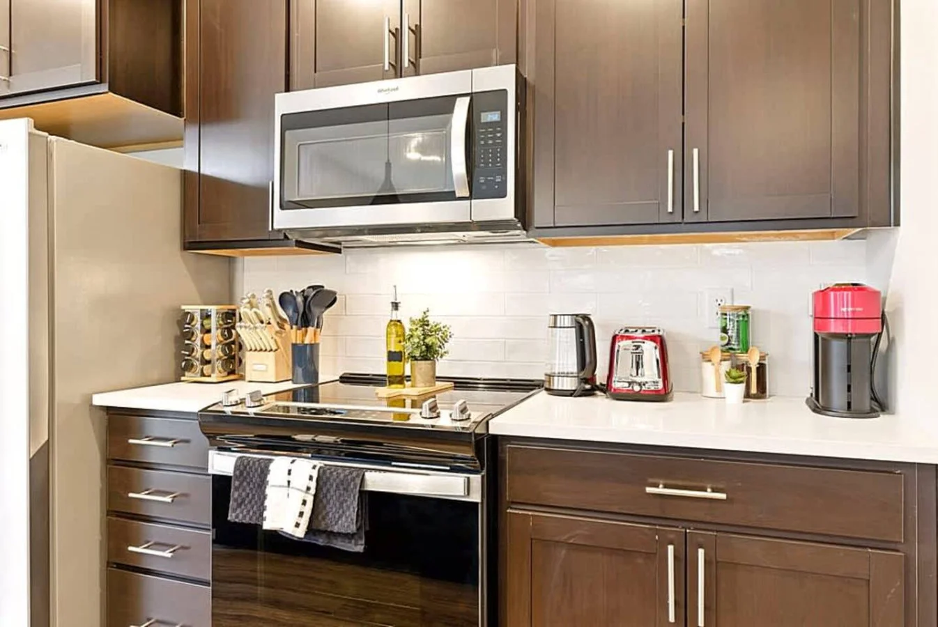 A detailed look at the kitchen’s stainless steel stove, microwave, and countertop appliances. Perfect for guests who love to cook, this setup offers convenience, efficiency, and all the essentials for meal preparation.