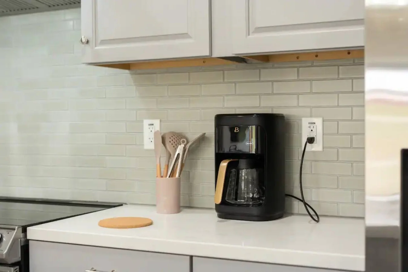 The coffee station is thoughtfully equipped with a variety of in-house consumables, including a selection of ground coffee, sweeteners, and creamers to suit every taste.