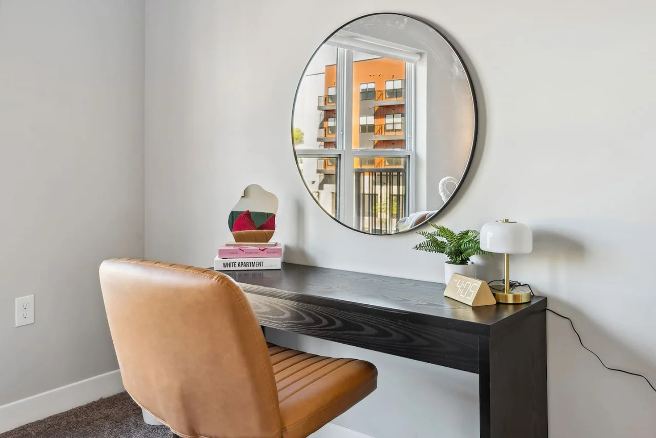 This cozy workspace in the master bedroom is perfect for productivity. Enjoy natural light, a comfortable chair, and a stylish desk setup. Ideal for work-from-home needs or planning your Dallas adventures.
