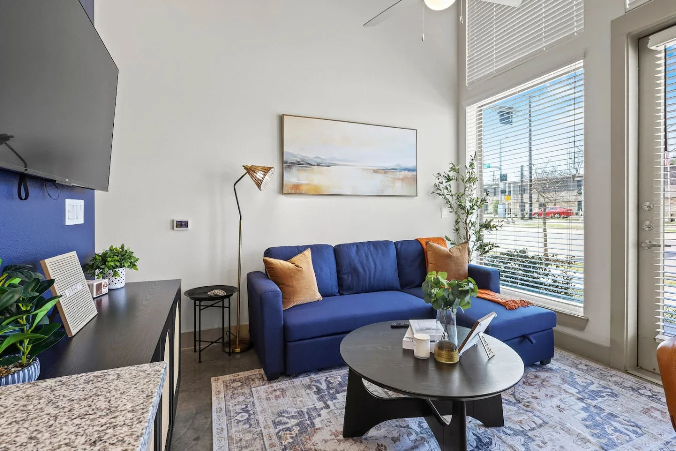You feel a sense of peace as you step into the living room , with its inviting decor and soothing tones.